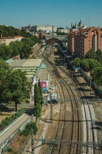 High angle view of train against buildings in city