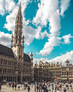 Group of people in front of historic building brussels