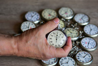 Cropped hand of man holding gauge