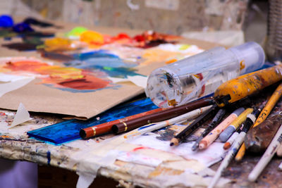 Close-up of paintbrushes on table