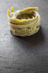 Close-up of raw tagliatelle on table