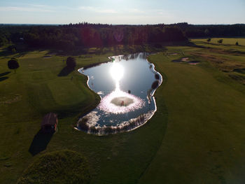 High angle view of lake and landscape against sky