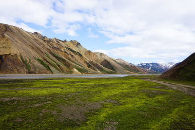 Scenic view of landscape and mountains against sky