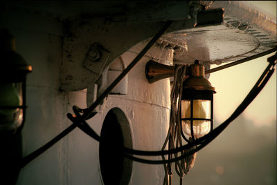 Close-up of rusty metal railing against wall