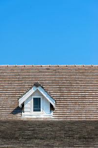Low angle view of roof top against sky