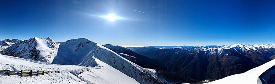 Scenic view of snowcapped mountains against clear sky