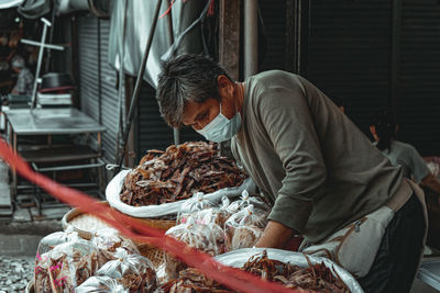 Man working at market stall