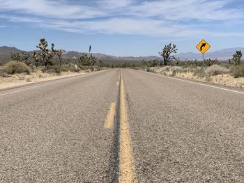 View of road sign against sky