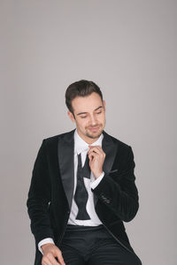 Portrait of young man against white background