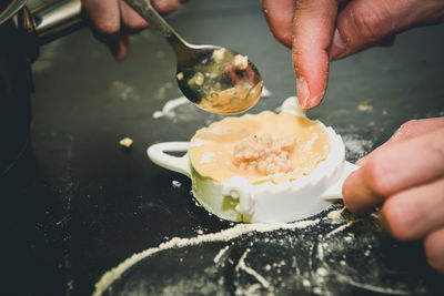 Close-up of chefs making ravioli pasta