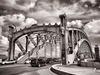 Low angle view of bridge against sky in city