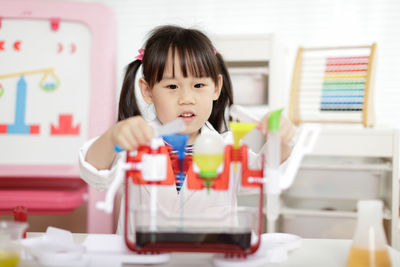 Portrait of girl in table