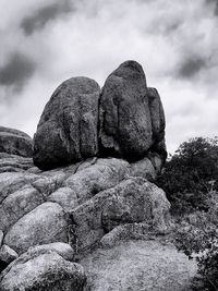 Low angle view of rocks against sky