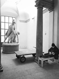 Man cycling in corridor