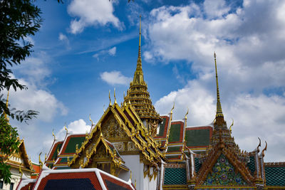 Low angle view of temple building against cloudy sky