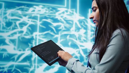 Young woman using digital tablet