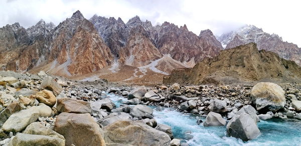 Panoramic view of rocks in mountains against sky