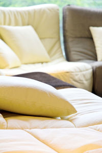 Close-up of sofa on bed at home