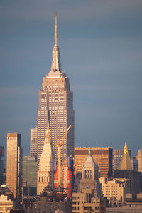 Buildings in city against sky