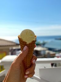 Close-up of hand holding ice cream cone