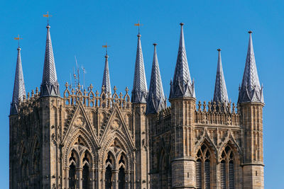 Low angle view of building against blue sky