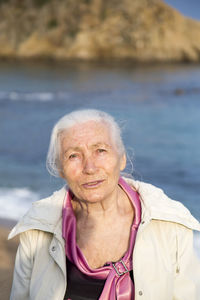 Portrait of woman against sea
