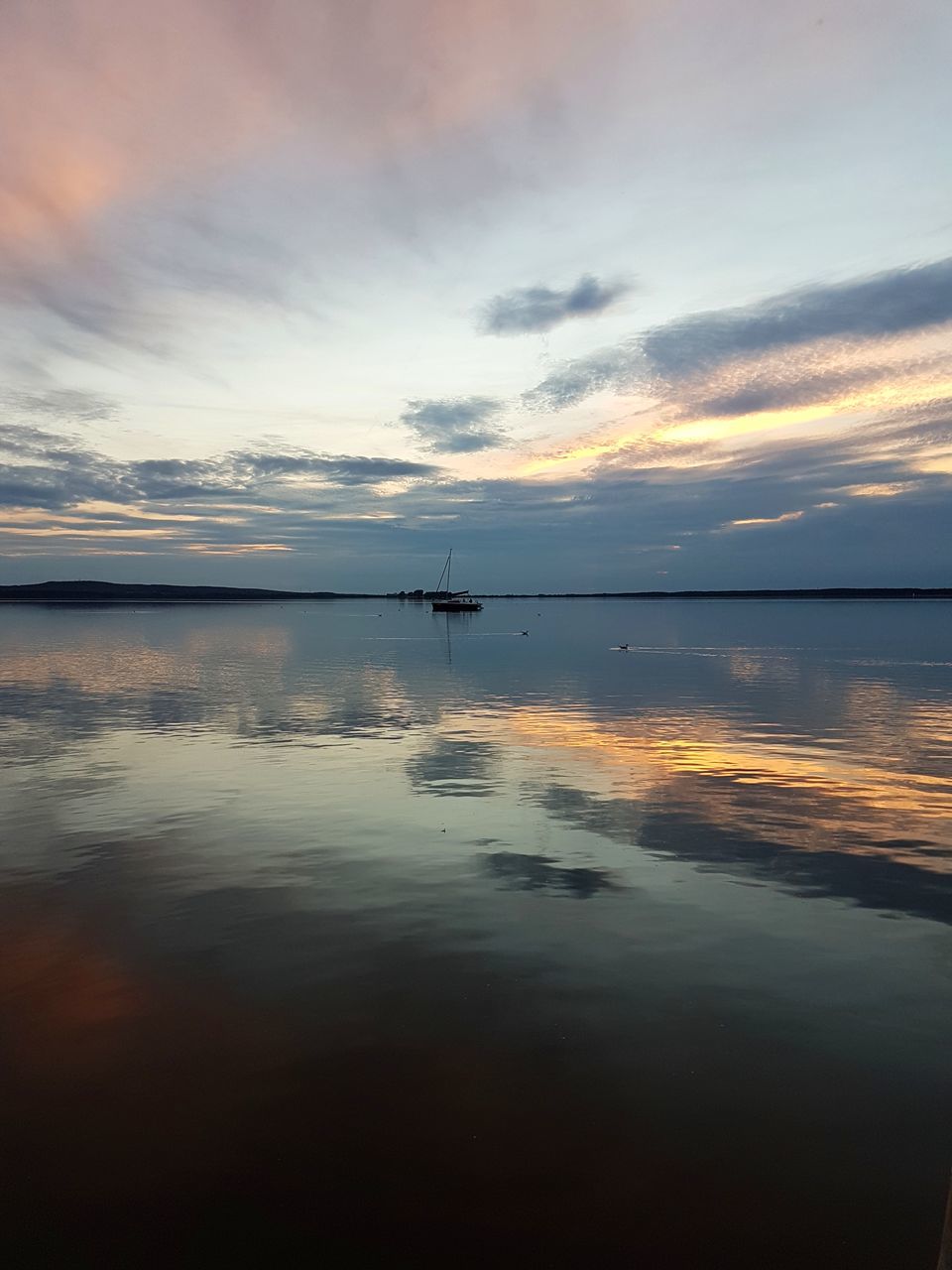 water, sky, cloud - sky, beauty in nature, reflection, sunset, scenics - nature, tranquil scene, tranquility, waterfront, sea, idyllic, nautical vessel, nature, transportation, no people, non-urban scene, mode of transportation, standing water, horizon over water