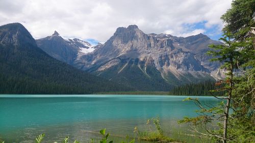 Scenic view of lake and mountains against sky