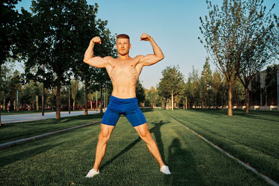 Full length of man exercising in park