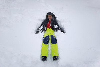 Portrait of man standing in snow