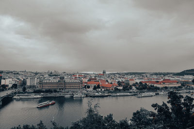 High angle view of river amidst buildings in city