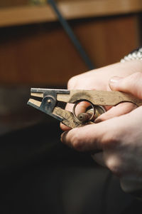 Close-up of hand with cigar cutter