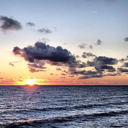 Scenic view of sea at sunset