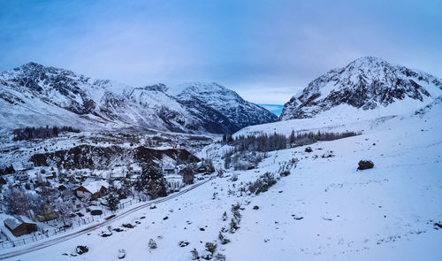 Scenic view of snowcapped mountains against sky