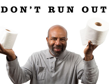 Portrait of smiling man standing against white background