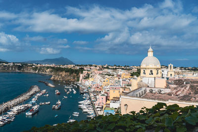 High angle view of townscape by sea