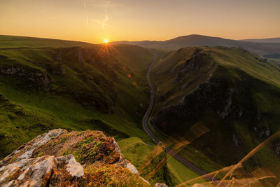 Scenic view of landscape against sky during sunset