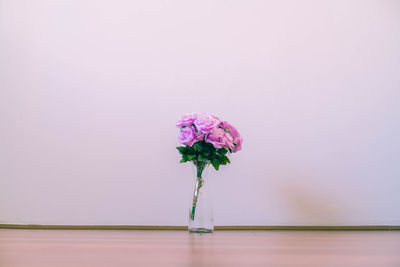 Close-up of pink flower vase on table