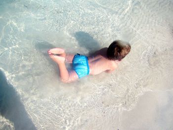 Woman jumping in water