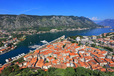 High angle view of kotor town by sea against mountains
