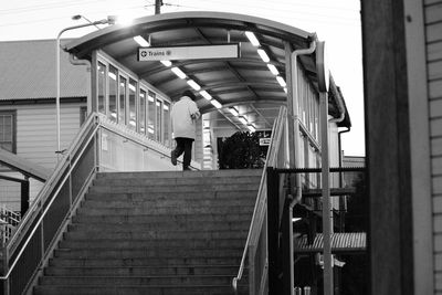 Low angle view of man standing on staircase