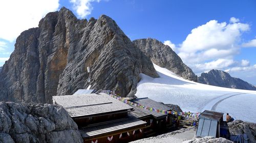 High angle view of houses against snow covered mountain