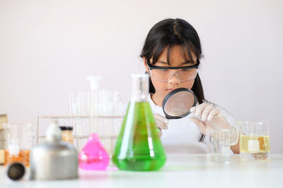 Girl experimenting at laboratory