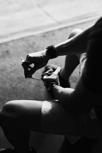 Bodybuilder's hand detail putting his glove on