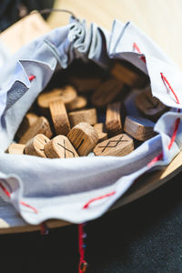 High angle view of wooden blocks in container