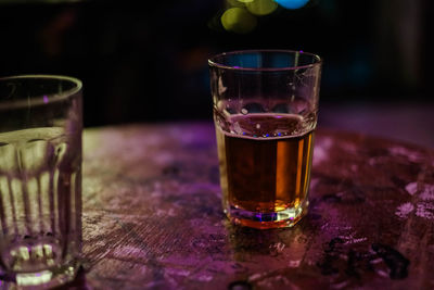 Close-up of beer glass on table