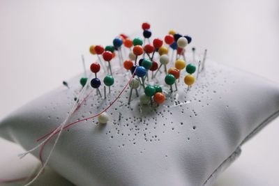 High angle view of multi colored candies on white background