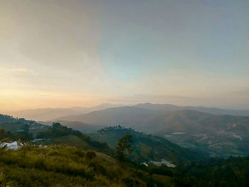 Scenic view of mountains against sky during sunset