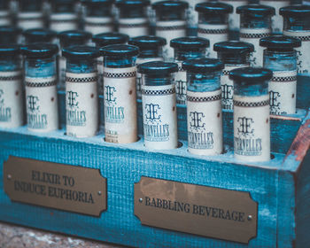 Close-up of bottles in container