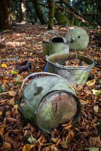 Close-up of old rusty metal on field